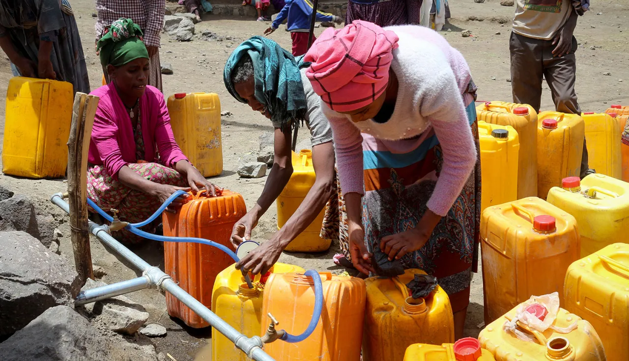 The ICRC reduces suffering by providing clean water, shelter, and essential services, ensuring people affected by armed conflict can live safely.