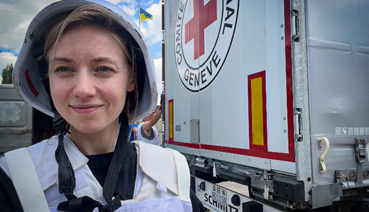 ICRC in Ukraine An ICRC worker standing in front of a marked truck
