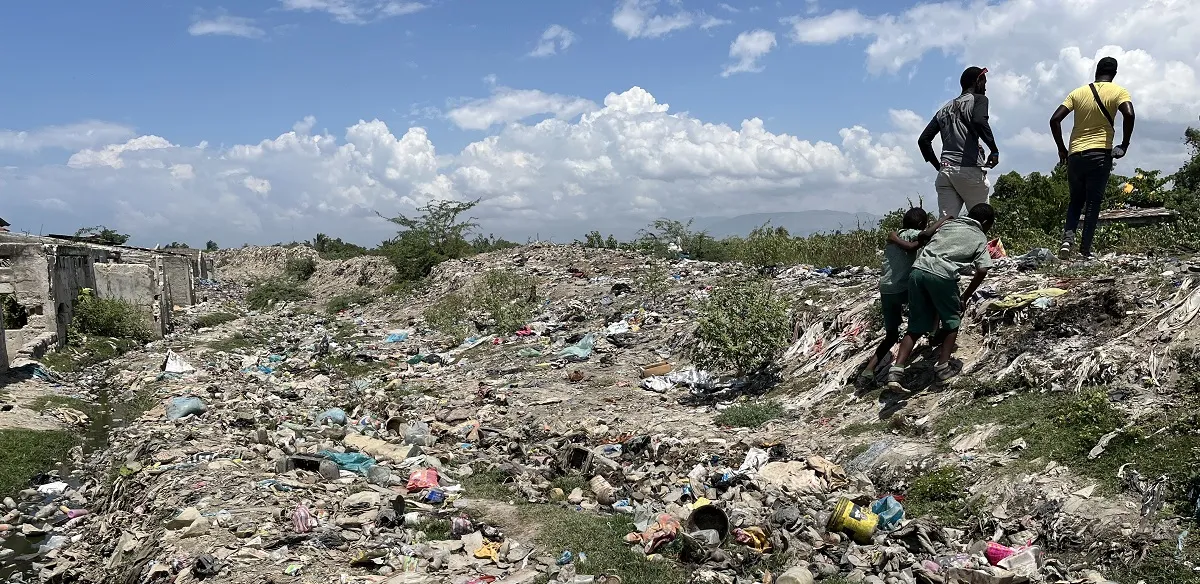 Men walk among the rubble in Haiti.